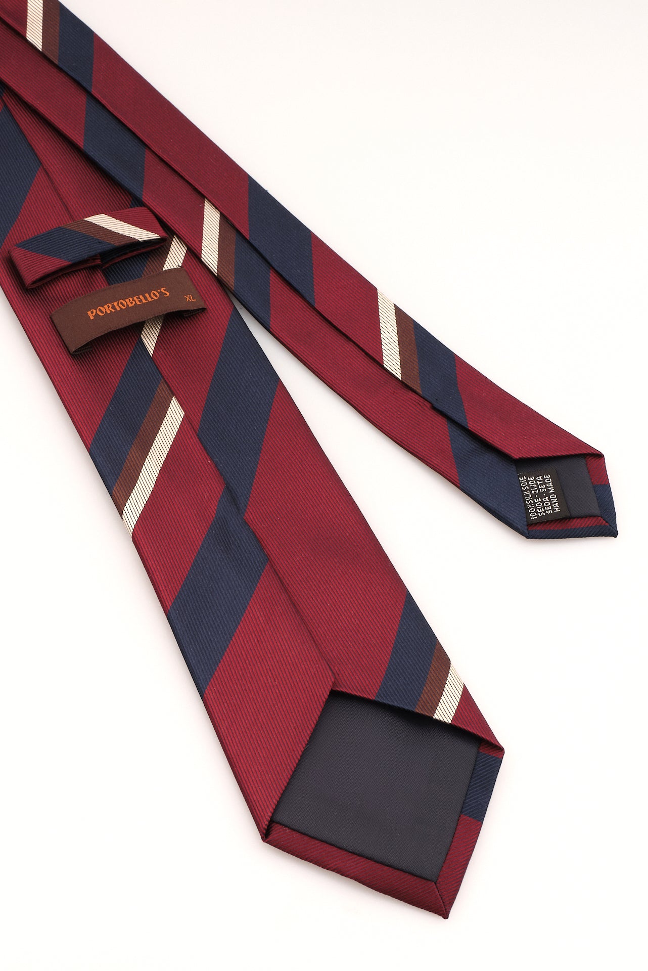 ΑΝΔΡΙΚΗ ΜΕΤΑΞΩΤΗ ΓΡΑΒΑΤΑ CLUB PORTOBELLO'S ΣΕ ΜΠΛΕ ΚΑΙ ΚΟΚΚΙΝΟ ΧΡΩΜΑ ΜΕ ΜΠΕΖ ΚΑΙ ΚΑΦΕ ΛΕΠΤΟΜΕΡΕΙΕΣ